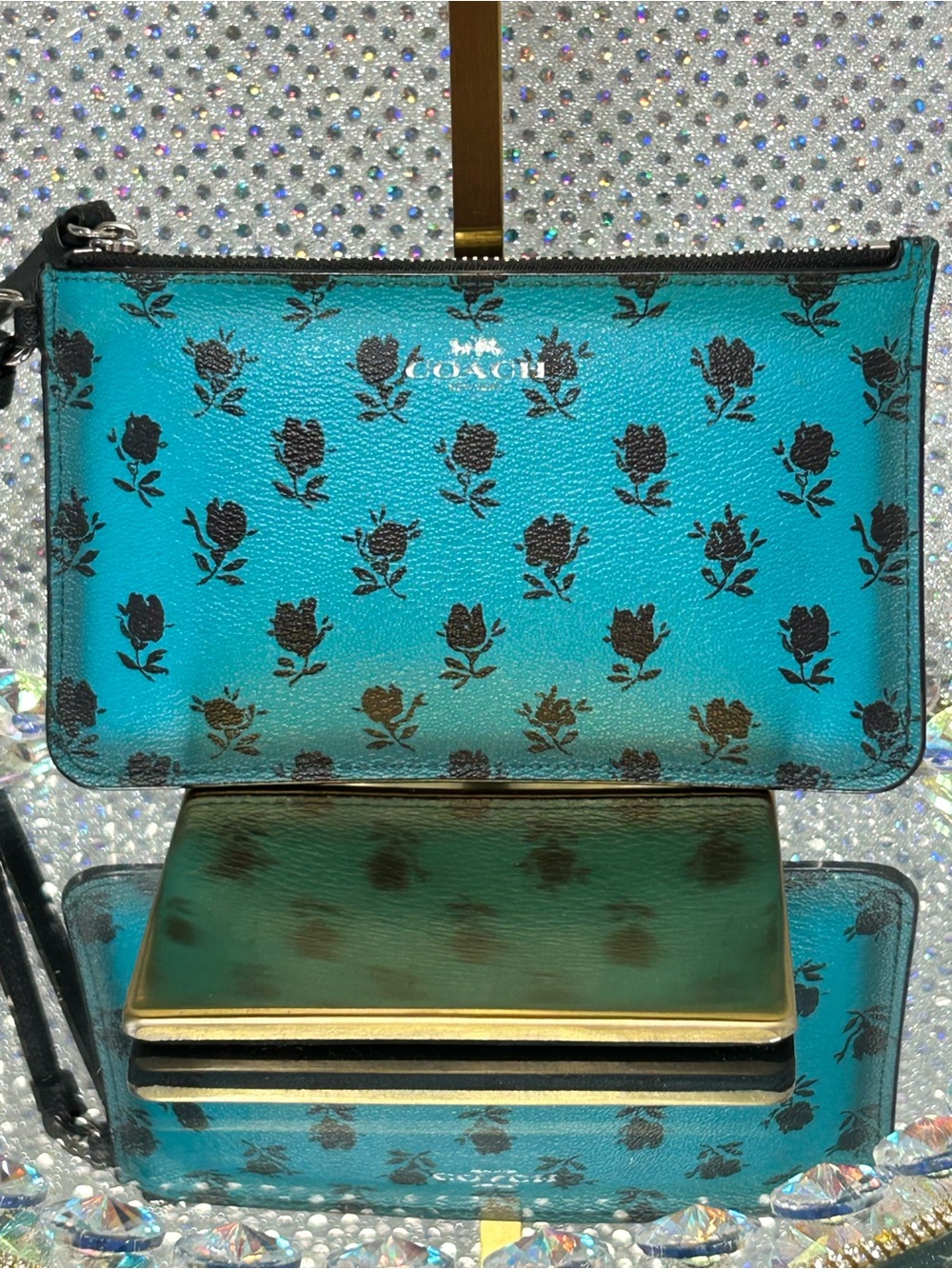COACH Turquoise Floral Print Wristlet Approx. 7 x 4